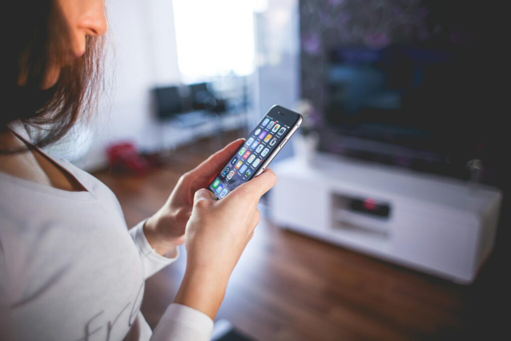 Woman browsing smartphone and contact someone.