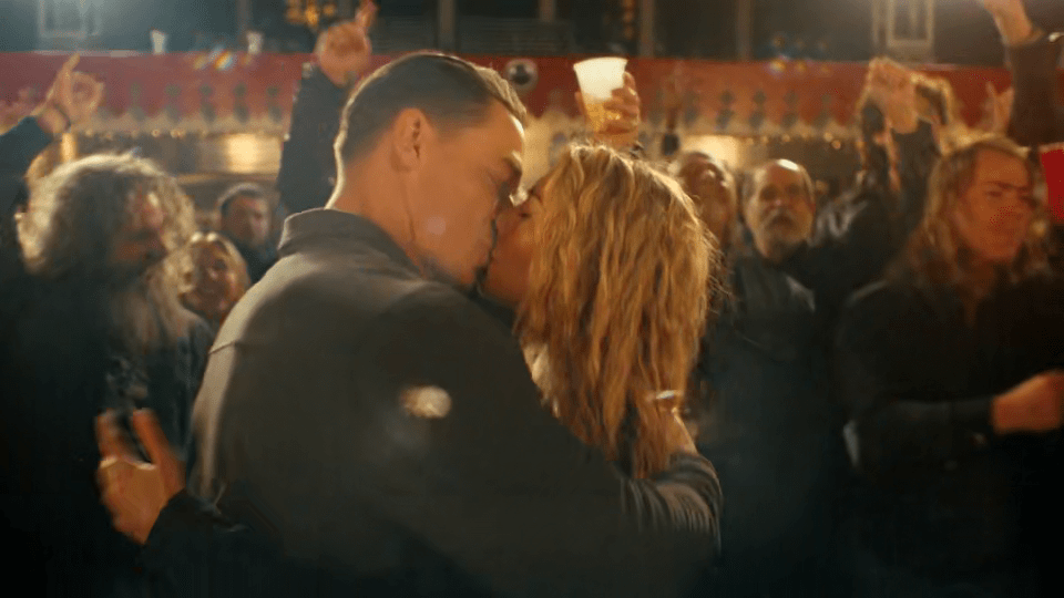 Peacemaker Emilia Harcort and Chris Smith kissing