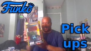 man holding sandtropper funko pop