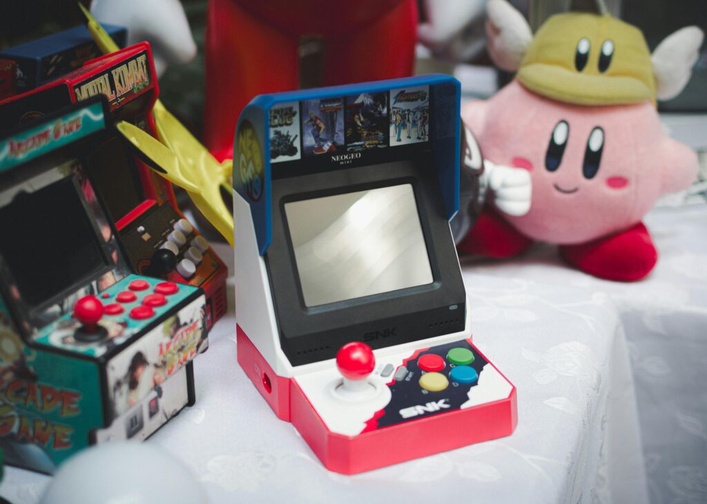 A collection of vintage arcade consoles and toys set in Tunis, Tunisia, evoking nostalgia.