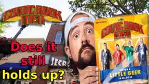 Kevin Smith holding a action figures